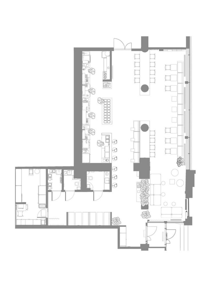 floor plan showing the axial layout, clear zoning, and the central 6.8-meter communal table