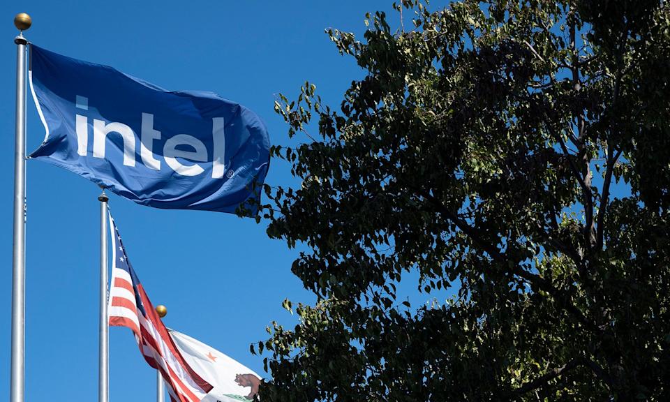 Intel's logo is displayed on a flag flying near an American flag. 