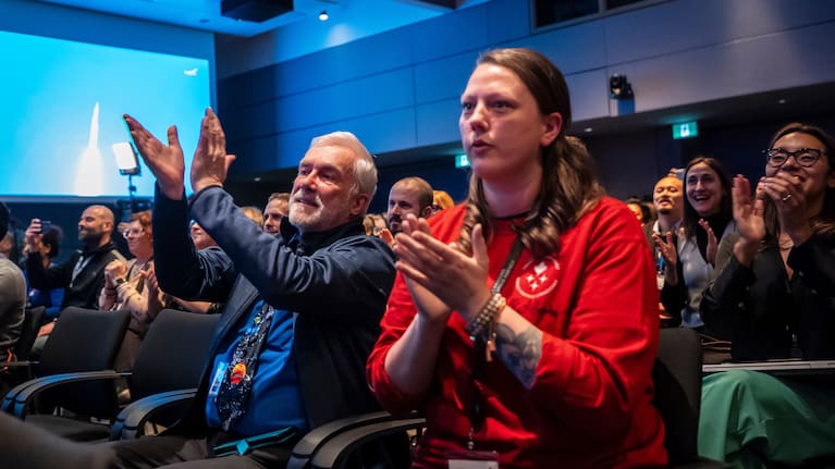 Employees of the Canadian Space Agency react during the successful launch of the Artemis II moon mission, at the Canadian Space Agency. 