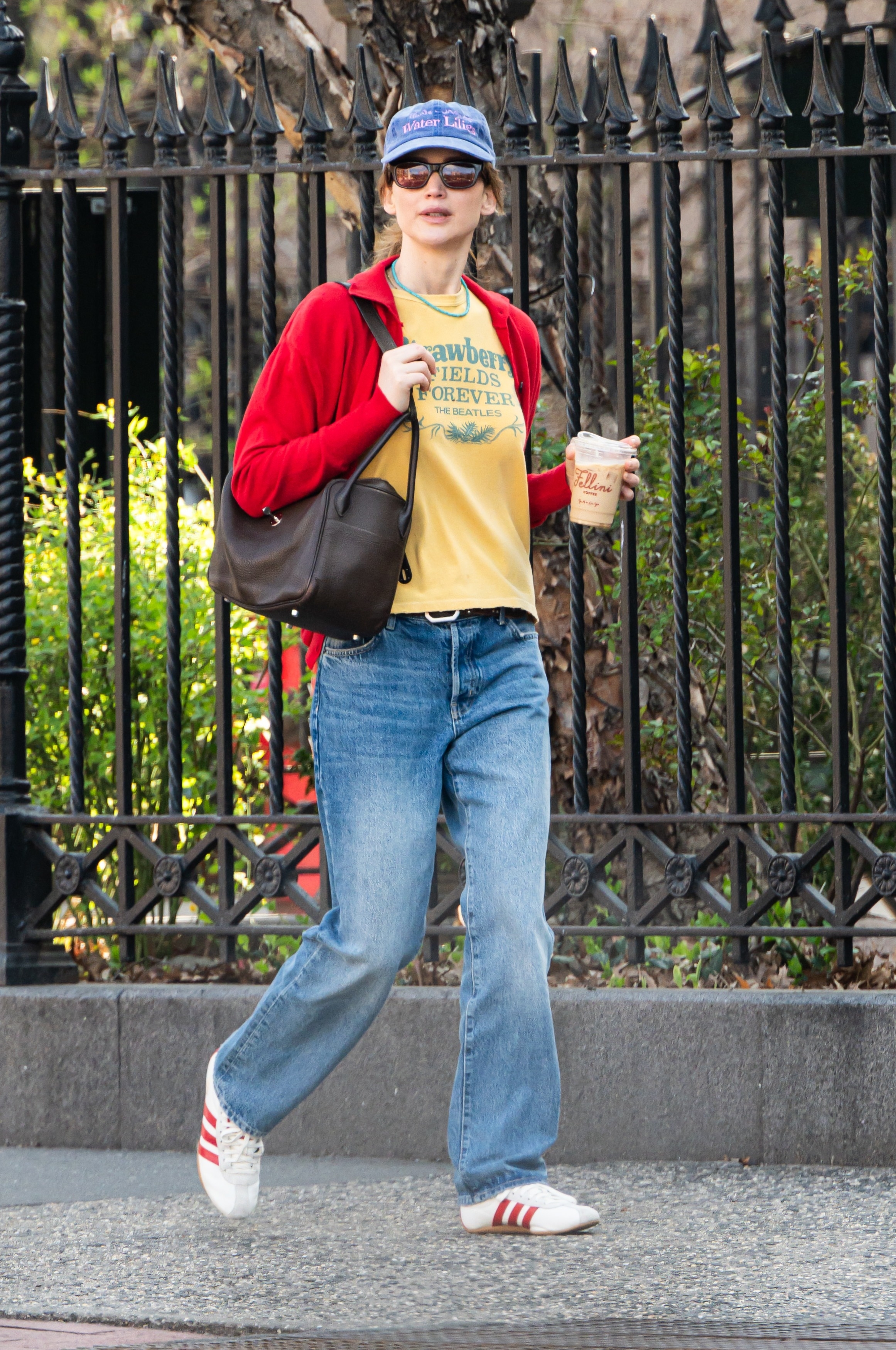 Jennifer Lawrence in New York City with coffee and a Hermes bag.