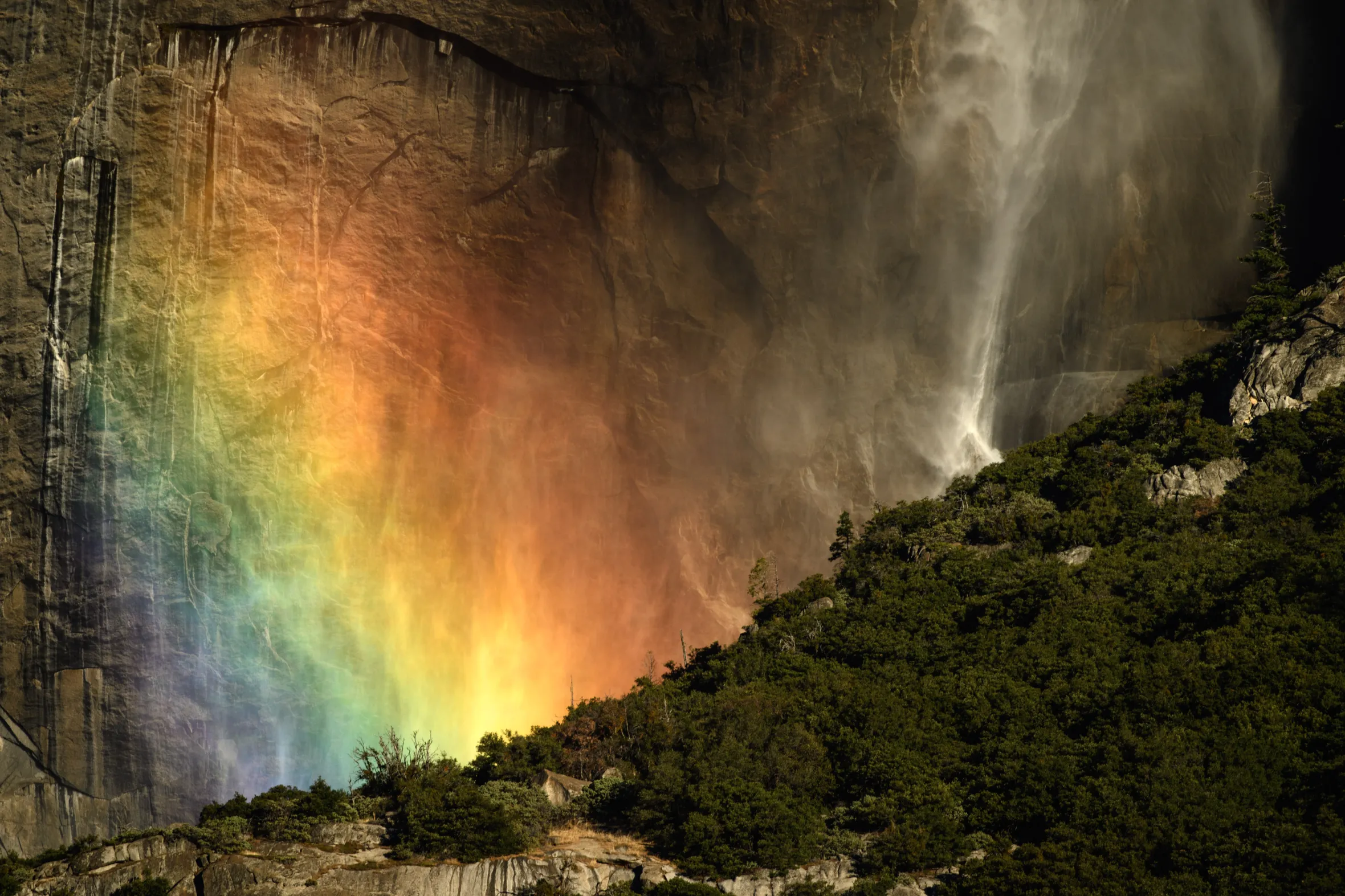 A rainbow created by mist from Upper Yosemite Falls.