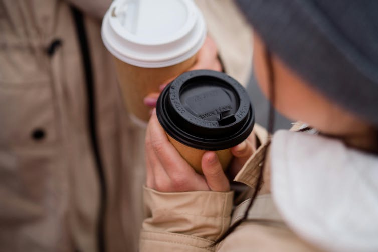 People holding coffee cup
