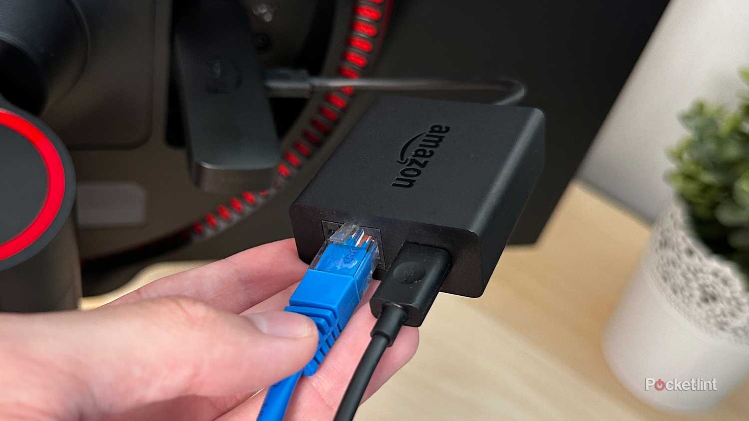 An Ethernet adapter connected to Fire TV Stick 4K Max.