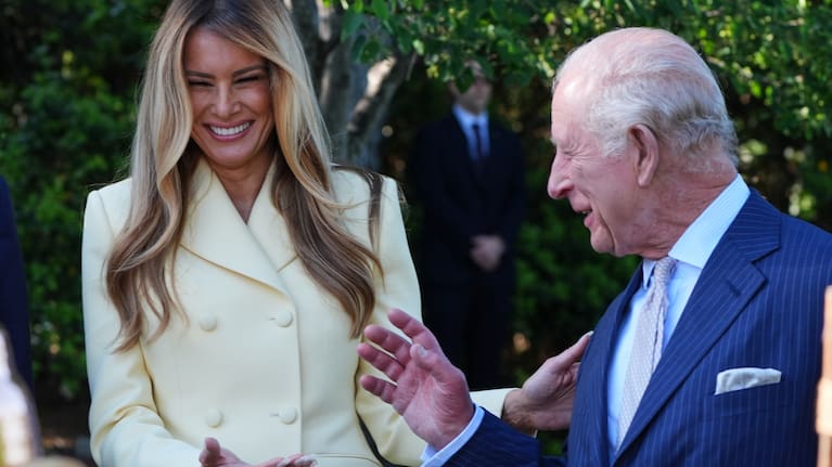 First lady Melania Trump and Britain's King Charles III talk during a tour of the White House garden and bee hive on the South Lawn of the White House.