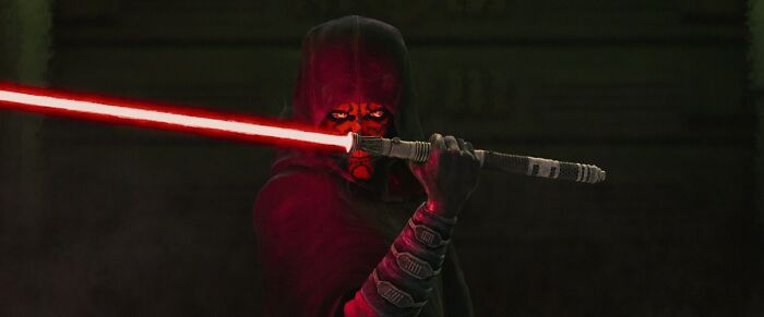 Star Wars Maul Shadow Lord character holding a red double-bladed lightsaber in a dark, ominous setting. Star Wars Maul Shadow Lord character holding a red double-bladed lightsaber in a dark, ominous setting.