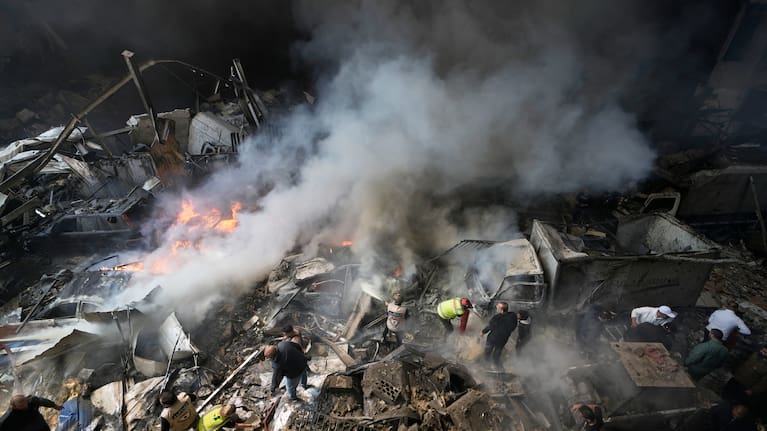 First responders search at the site of an Israeli airstrike that struck an apartment building in Beirut, Lebanon.