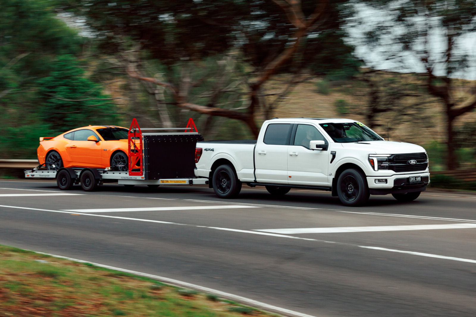 Ford F-150 Platinum towing a Ford Mustang