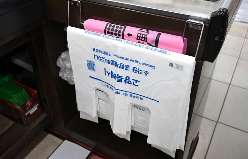 Government-regulated waste bags are displayed at the checkout counter of a grocery store in Goyang, South Korea, on March 30, 2026.