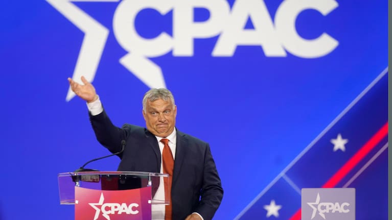 Hungarian Prime Minister Viktor Orban waves has he walks onto stage to speak at the Conservative Political Action Conference