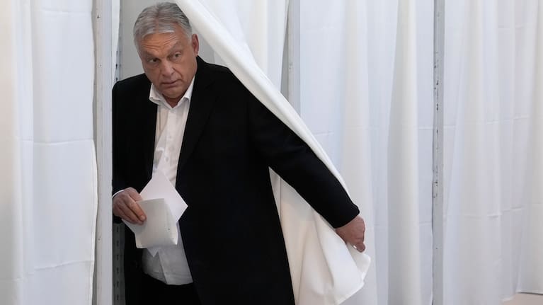Hungary's Prime Minister Viktor Orban prepares to cast his ballot