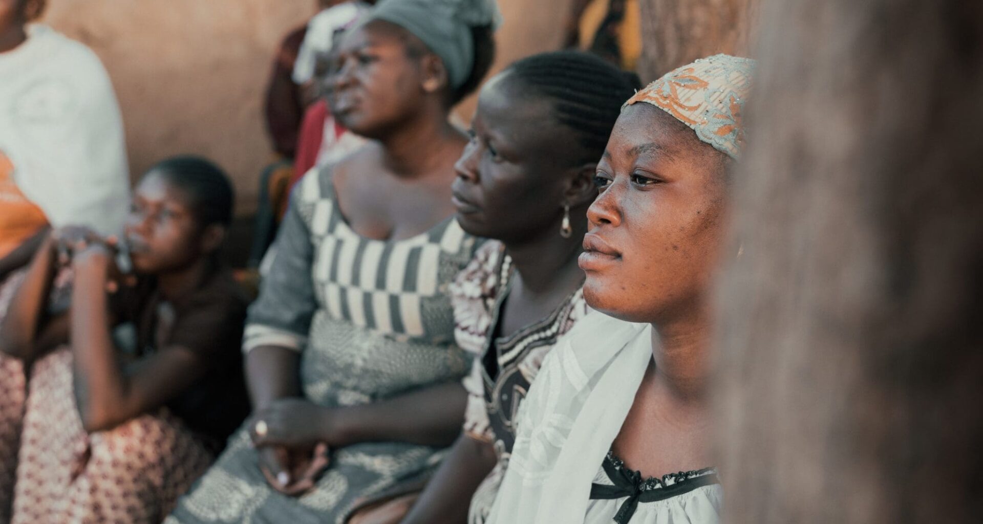 Ouagadougou, Burkina Faso, December 2017. The sub-Saharan country is struck every year by many cases of malaria, an endemic disease that represents a serious problem for the population. This image, taken during a photographic documentary, shows a group of women, from a village a few kilometers from Ouagadougou, as they attend a demonstration lesson on the use of mosquito nets against malaria. The lesson is held by a group of women belonging to a health team who periodically travels from village to village to inform the population about the risks of the disease.