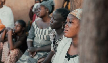 Ouagadougou, Burkina Faso, December 2017. The sub-Saharan country is struck every year by many cases of malaria, an endemic disease that represents a serious problem for the population. This image, taken during a photographic documentary, shows a group of women, from a village a few kilometers from Ouagadougou, as they attend a demonstration lesson on the use of mosquito nets against malaria. The lesson is held by a group of women belonging to a health team who periodically travels from village to village to inform the population about the risks of the disease.