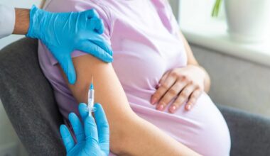 A pregnant woman makes a vaccination. Selective focus. doctor.