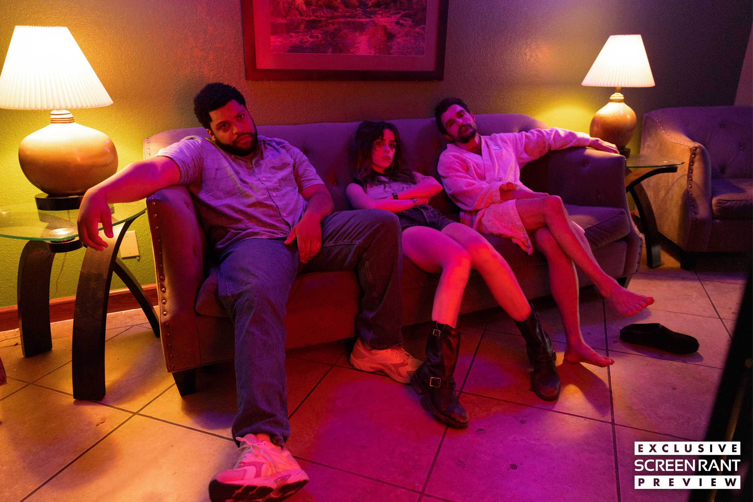 O'Shea Jackson Jr., Kiernan Shipka, and Dave Franco sitting on a neon-lit couch in Idiots