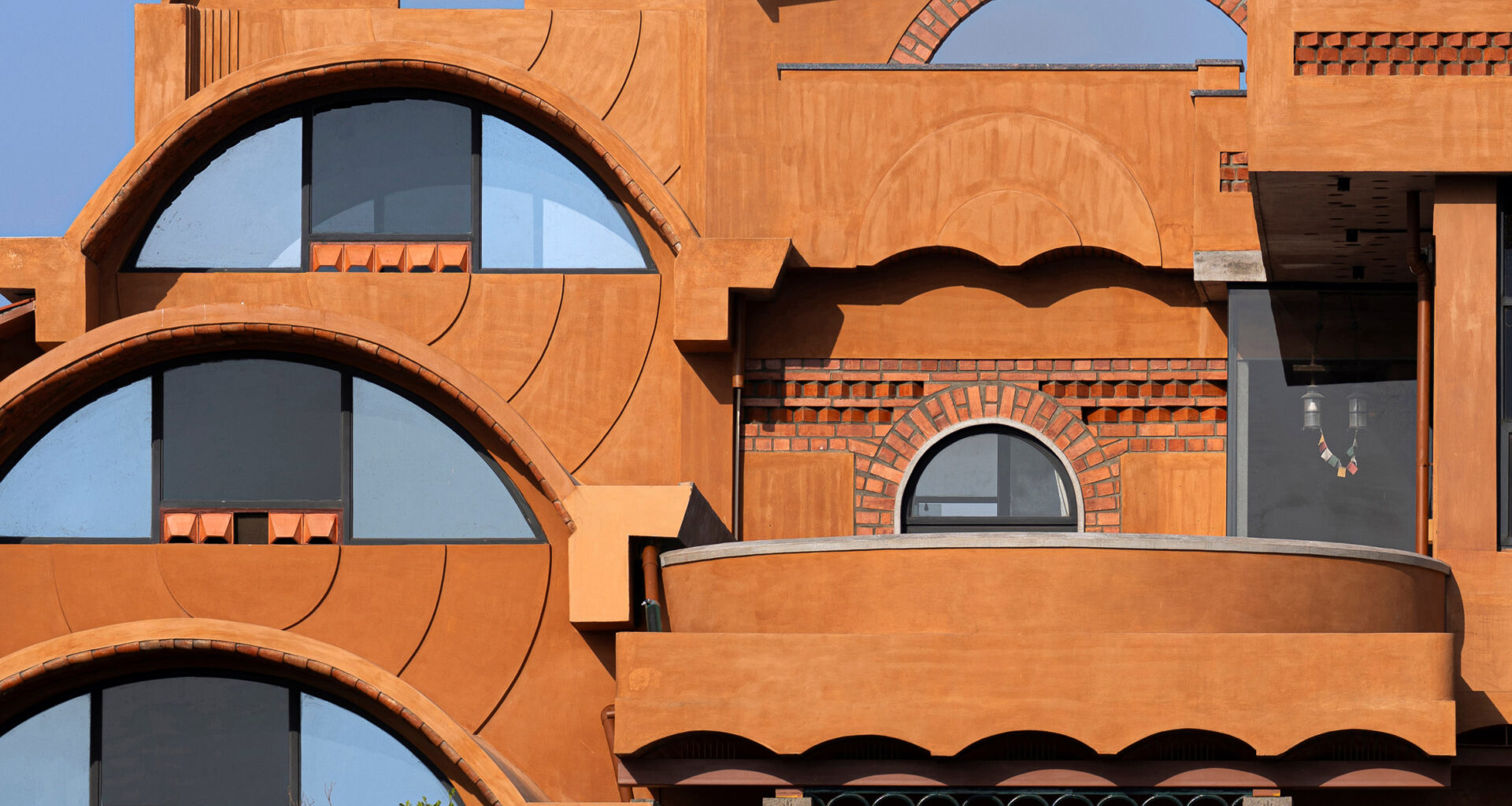 Iki Builds uses local stone and earth for vaulted home in India