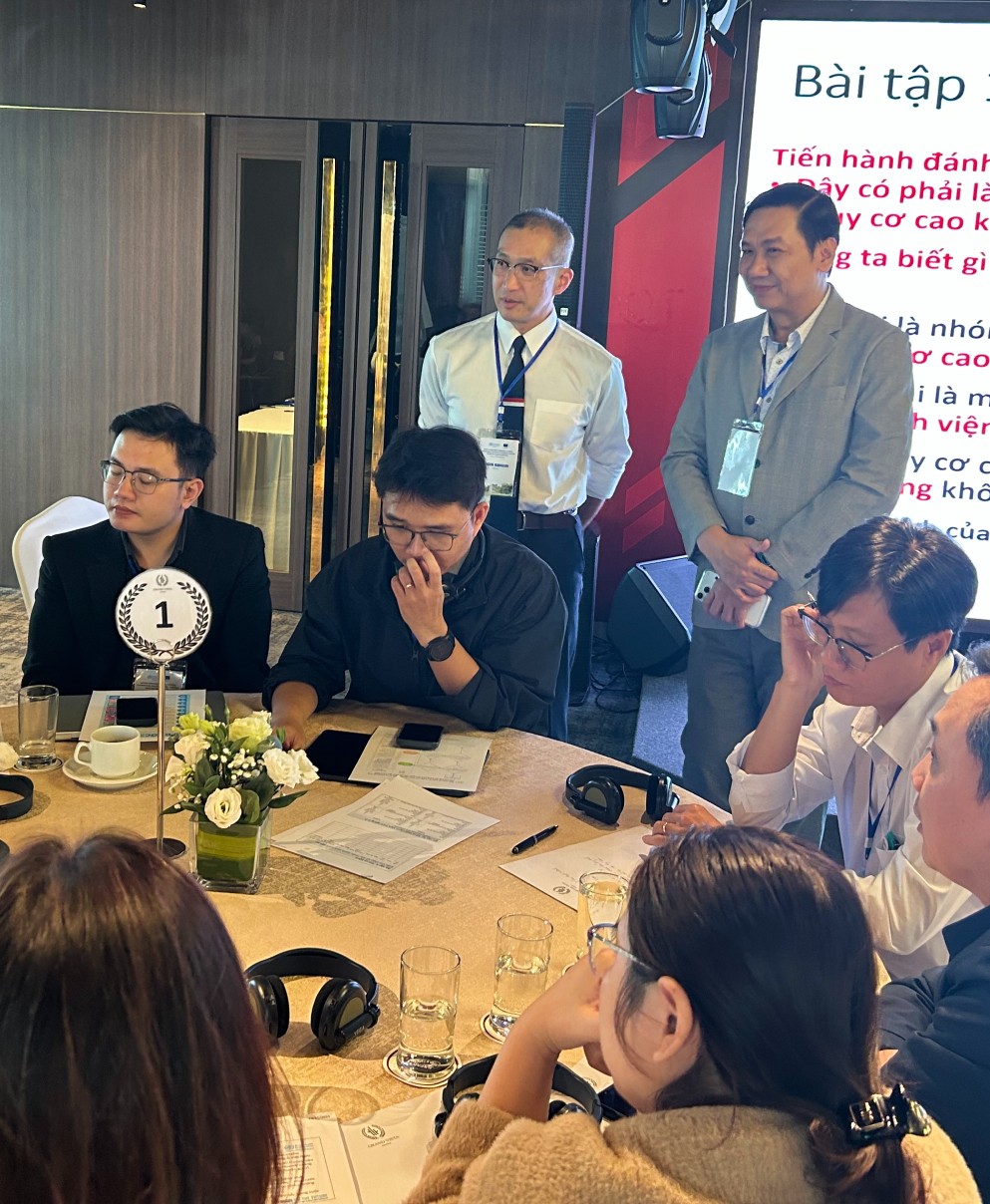 Meeting on AMR in Vietnam Women and men sitting at a meeting table