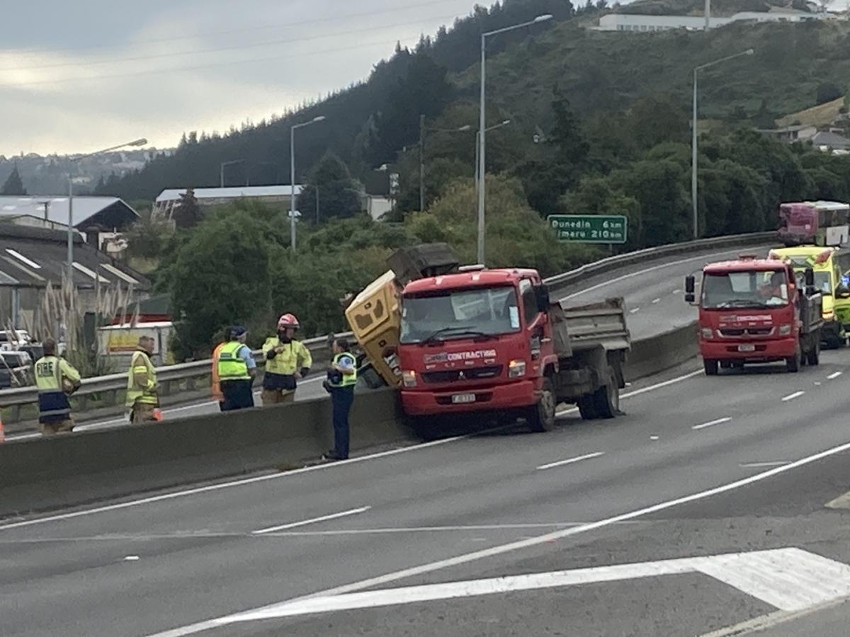 'Significant delays' after digger comes off truck on Dunedin motorway