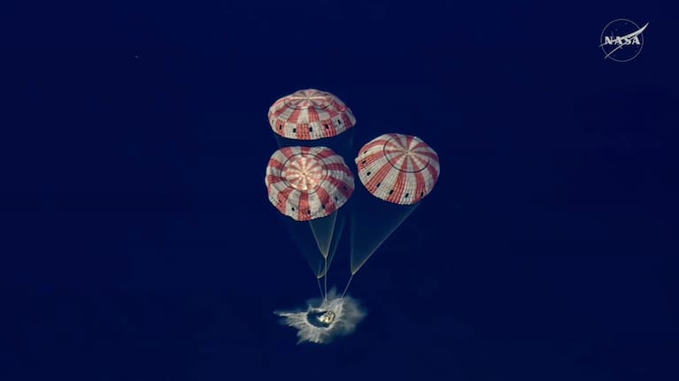 In this image from video provided by NASA, the Artemis II Orion capsule splashes down in the Pacific Ocean on Saturday.