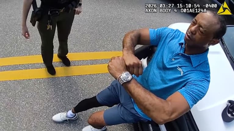 In this image taken from police body camera video released by the Martin County, Florida Sheriff's Office, golfer Tiger Woods performs a field sobriety test for sheriff's deputies following a car crash in Jupiter Island