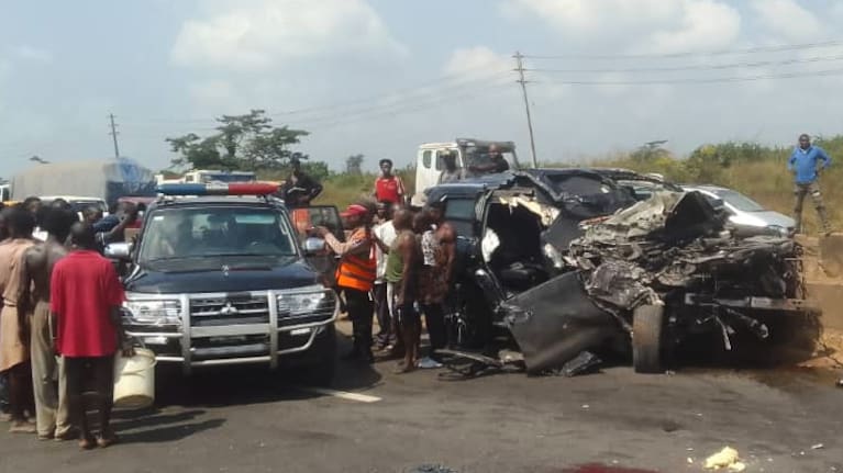 In this photo provided by the Federal Road Safety Corps, people gather at the accident scene of British boxer Anthony Joshua in Lagos, Nigeria