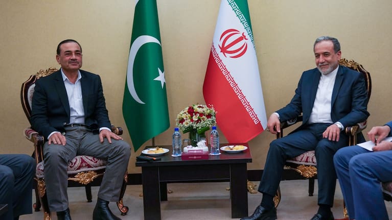 In this photo released by the Iranian Foreign Ministry, Iranian Foreign Minister Abbas Araghchi, right, meets with Pakistan's Army Chief Field Marshal Gen. Asim Munir in Tehran.