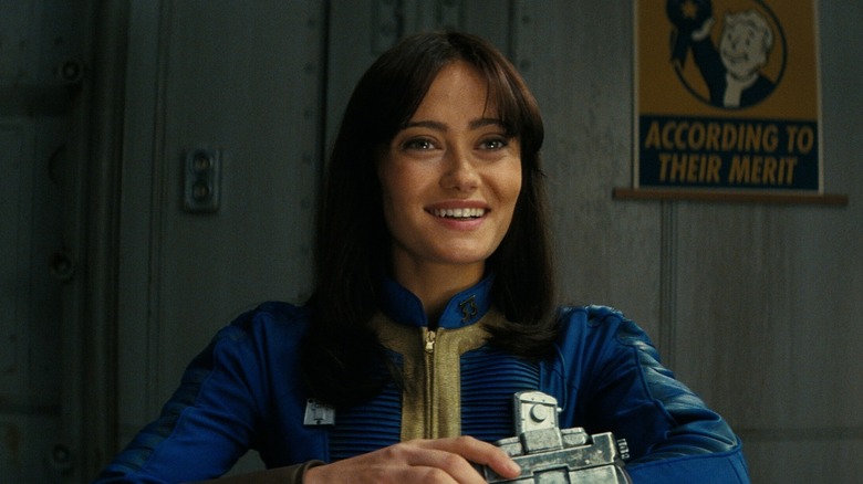 Lucy smiling and seated in Vault 33