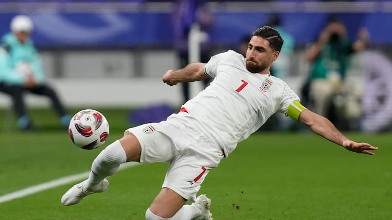 Iran's Alireza Jahanbakhsh passes the ball.