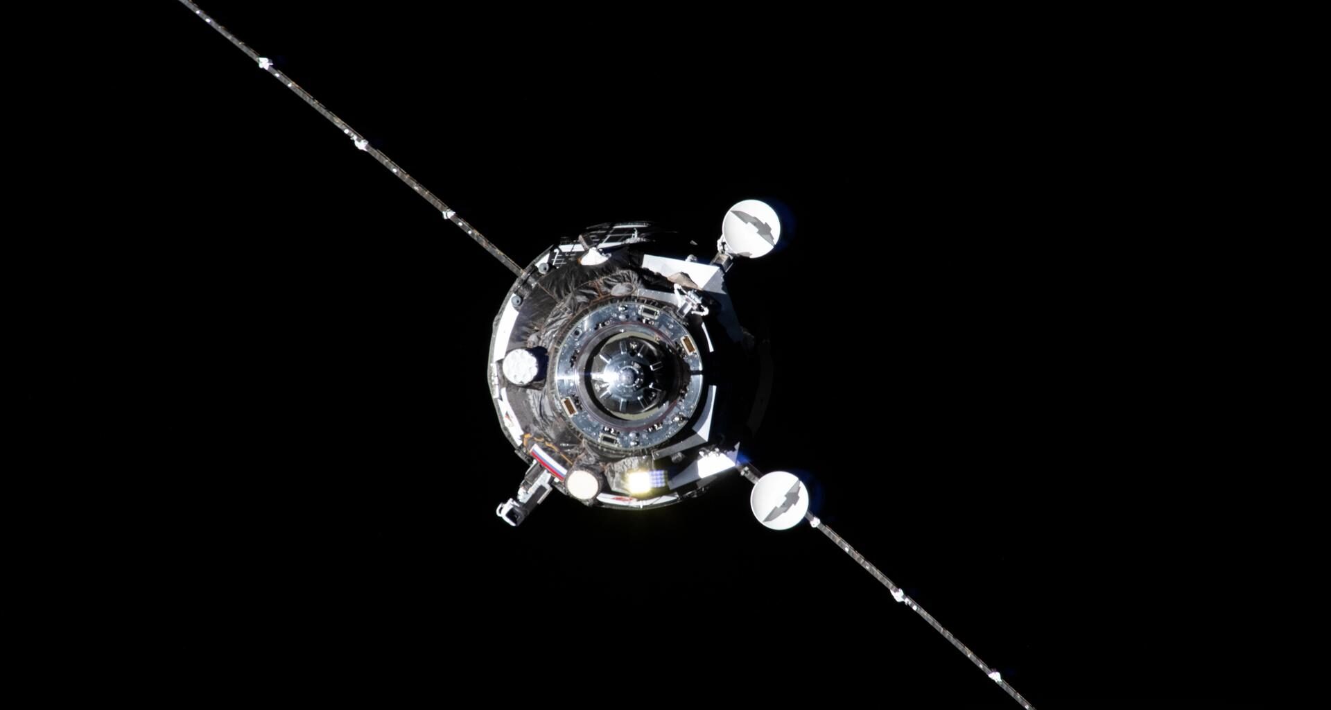 The Progress 93 resupply ship from Roscosmos, carrying about three tons of food, fuel, and supplies for the Expedition 73 crew, is pictured automatically approaching the International Space Station before docking to the Zvezda service module's rear port for six months of cargo activities.