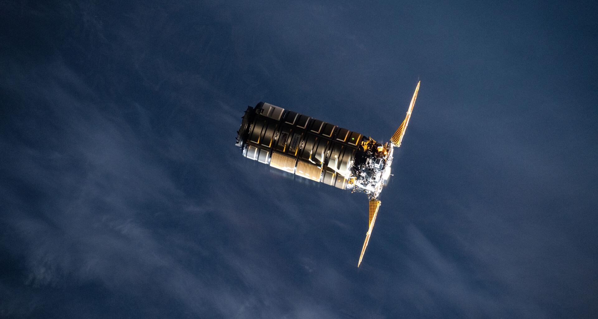 Northrop Grumman’s Cygnus XL cargo spacecraft, carrying more than 11,000 pounds of new science investigations and supplies for the Expedition 73 crew, approaches the International Space Station. The two spacecraft were orbiting 262 miles above northeastern China just before an orbital sunset. Cygnus XL is an expanded version of Northrop Grumman’s previous Cygnus cargo vehicle, offering increased payload capacity and pressurized cargo volume.