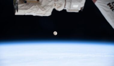 A waxing gibbous Moon is pictured above Earth's atmosphere from the International Space Station as it soared 268 miles above far eastern Canada. A portion of the Canadarm2 robotic arm's latching end effector is captured in the top foreground of the image.