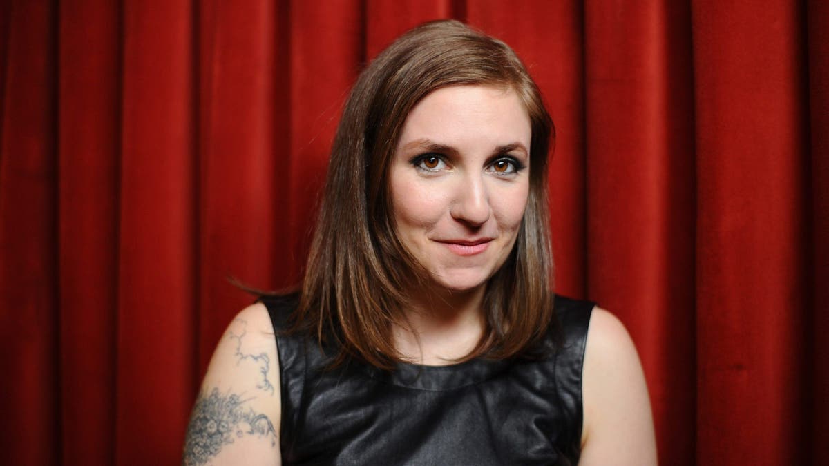Lena Dunham standing at the Girls Greenroom Photo Op at SXSW in Austin, Texas