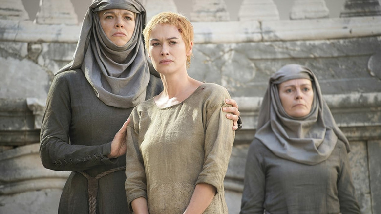Lena Headey as Cersei Lannister prepares to take a walk of atonement while surrounded by two septas in Game of Thrones