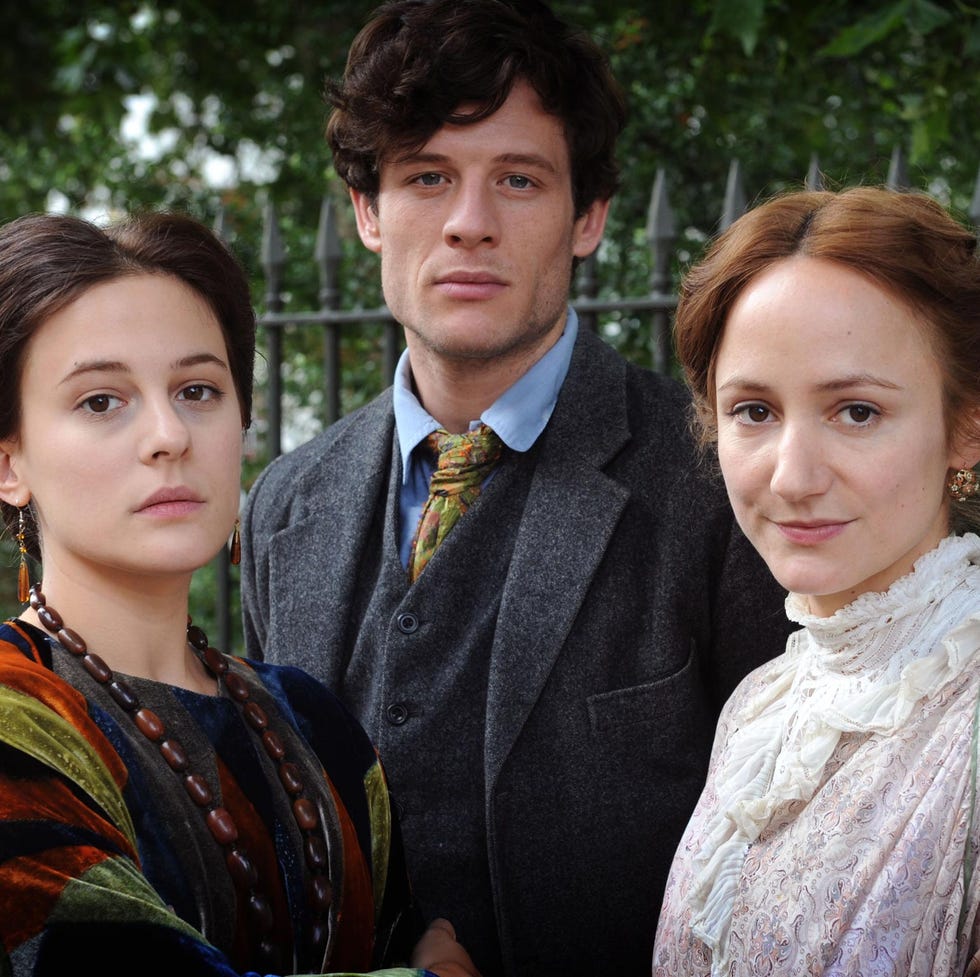 group portrait of three individuals in period clothing group portrait of three individuals in period clothing