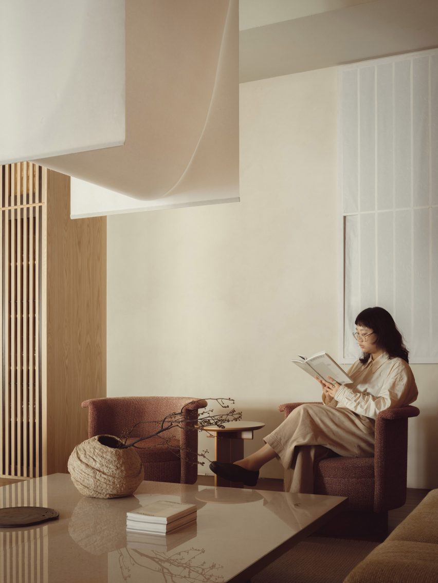 Woman reading in restaurant