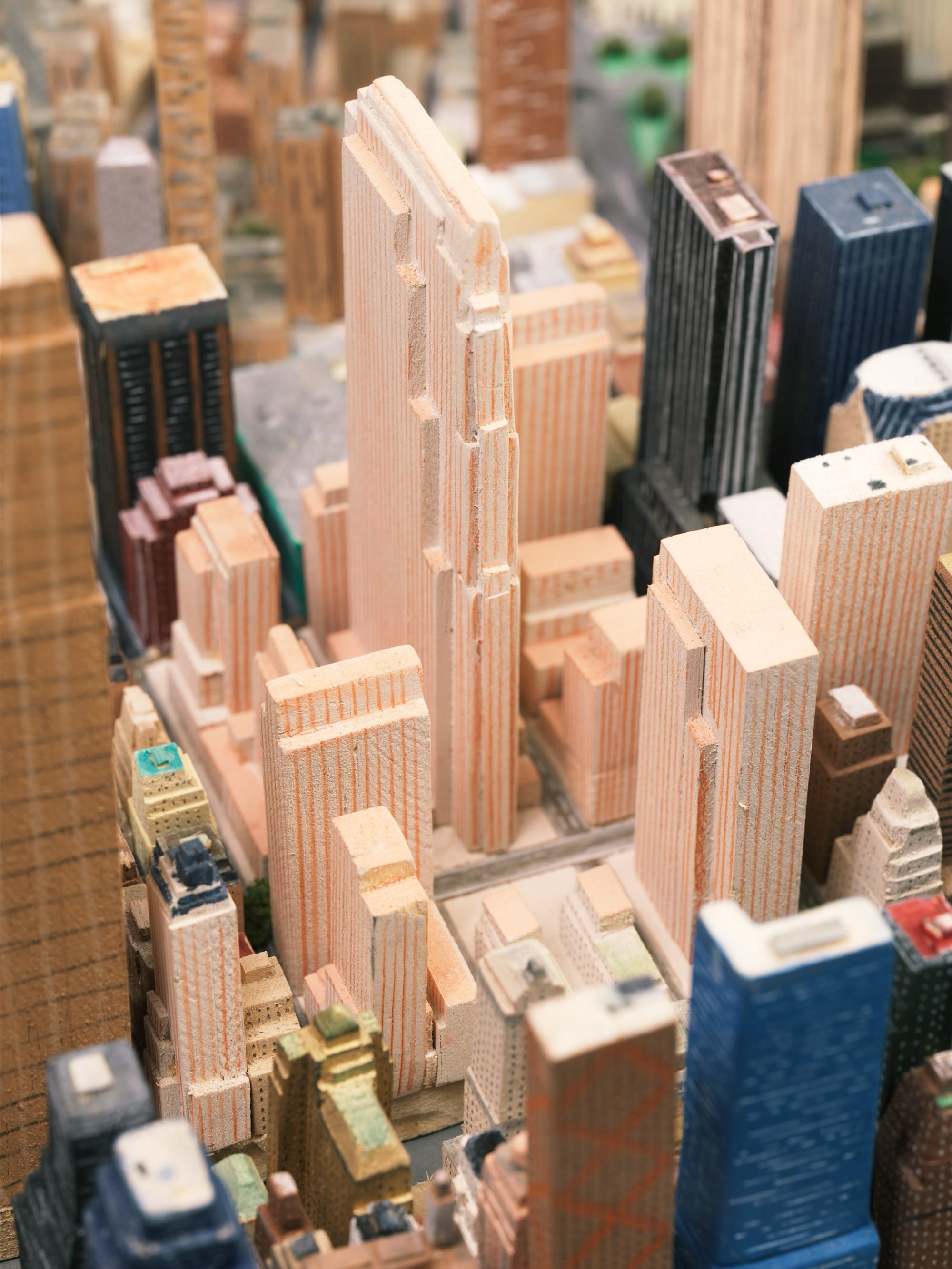 a detail of a steam ship and an expansive, hand-built scale model of New York City