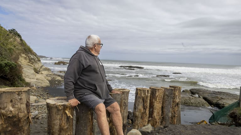 Beattie atop of the new walkway looking over his beloved Sunset Beach. 