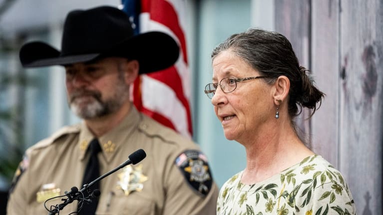 Michelle Impala, right, sister of Laura Ann Aime, speaks, joined by Utah County Sheriff Mike Smith.