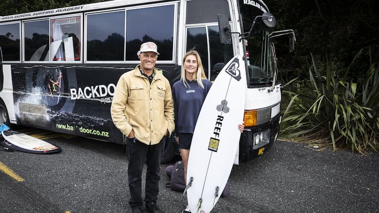 Morse and Hishon in front of the Academy’s bus used to transport students to and from the waves.