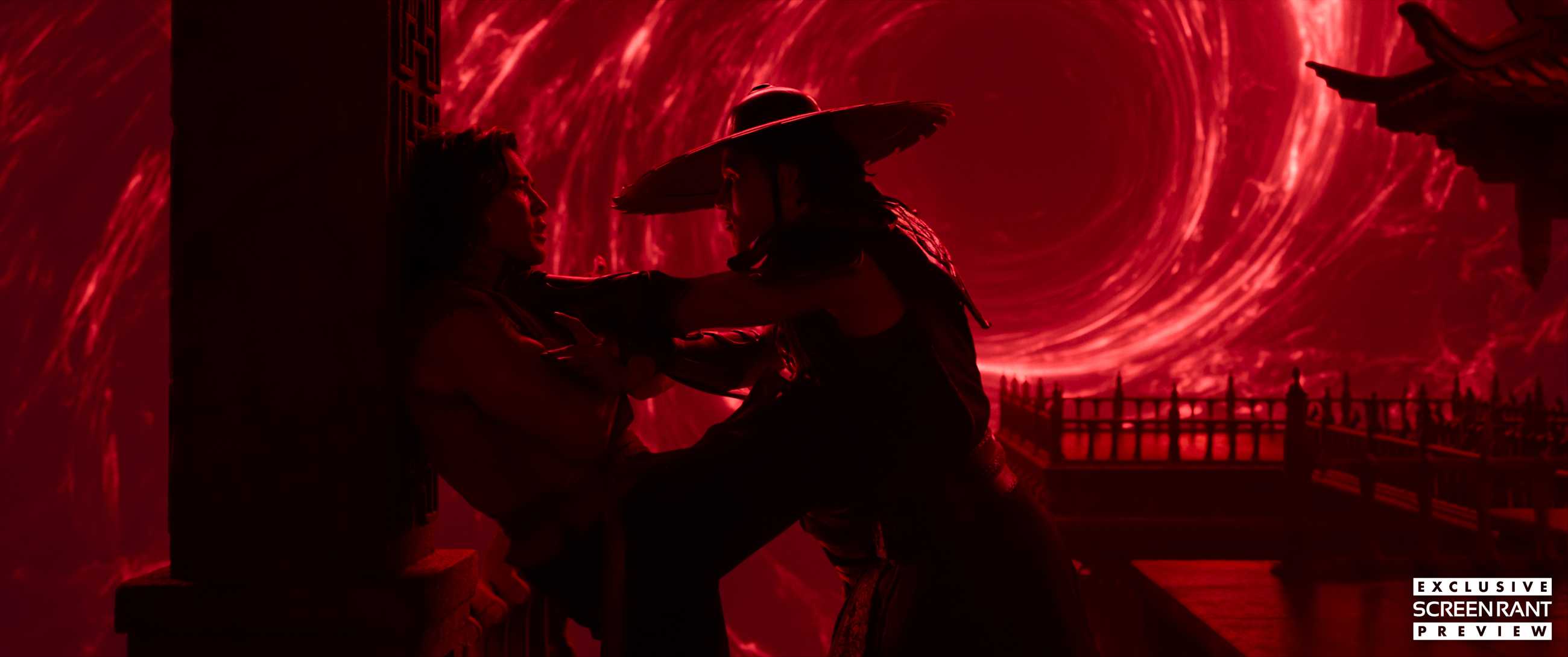 Kung Lao chokes Liu Kang against a red swirling vortex background in Mortal Kombat 2