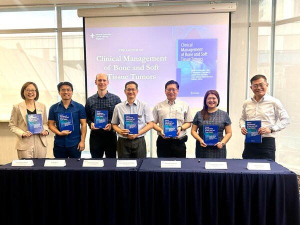 Adjunct Associate Professor Chee Cheng Ean (leftmost), Executive Director of the National University Cancer Institute, Singapore (NCIS), and Professor Lim Soon Thye (rightmost), Chief Executive Officer of the National Cancer Centre Singapore, with the editors of Clinical Management of Bone and Soft Tissue Tumors at the book launch. From left: Dr Choo Bok Ai, Associate Professor James Hallinan, Adjunct Associate Professor Mark Edward Puhaindran, Associate Professor Victor Lee Kwan Min, and Dr Angela Pang Shien Ling.