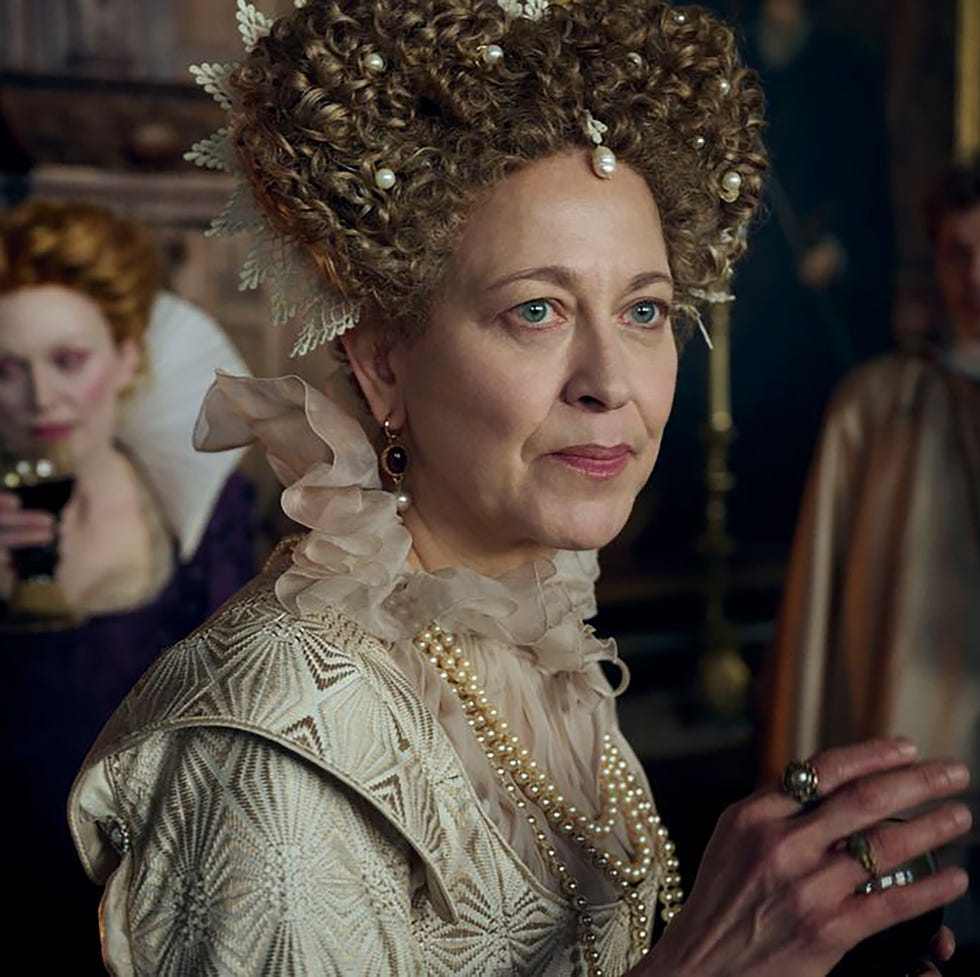 historical gathering featuring individuals in elaborate costumes historical gathering featuring individuals in elaborate costumes