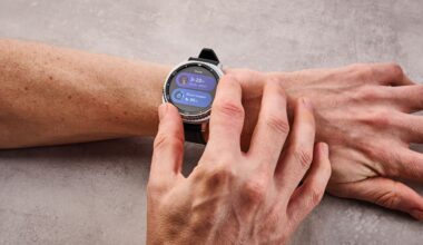 The Samsung Galaxy Watch 8 Classic on a man's wrist; he turns its dial to select its sleep features.