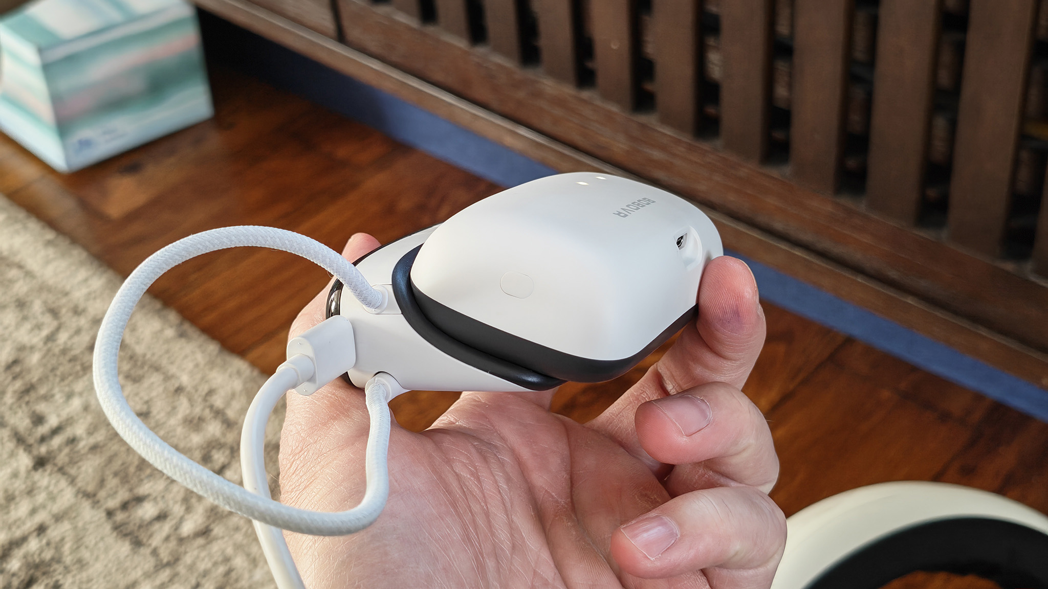 The BoboVR S3 Pro battery dock charging a battery pack