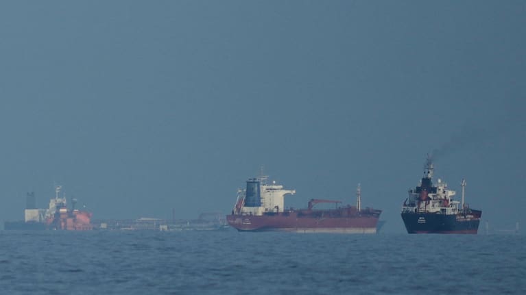 Oil tankers and cargo ships line up in the Strait of Hormuz as seen from Khor Fakkan, United Arab Emirates, Wednesday, March 11, 2026.