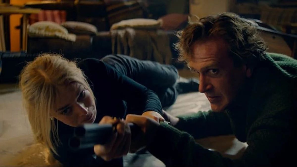 lisa and dan wrestle for a gun