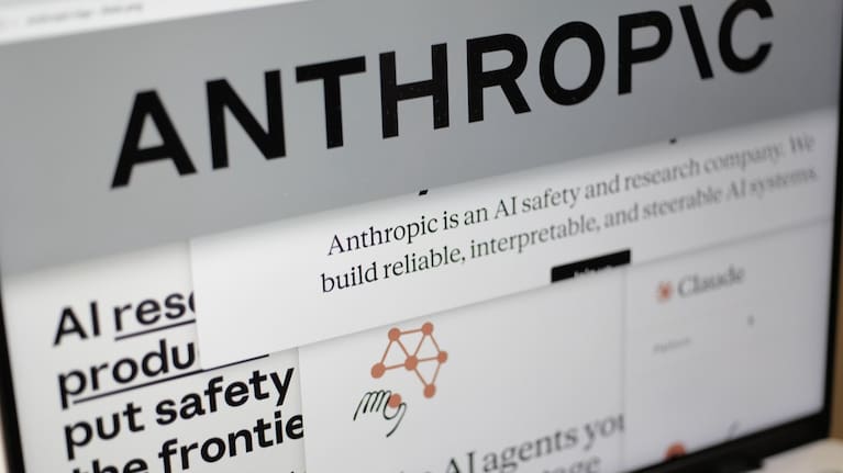 Pages from the Anthropic website and the company's logo are displayed on a computer screen in New York on February 26, 2026.