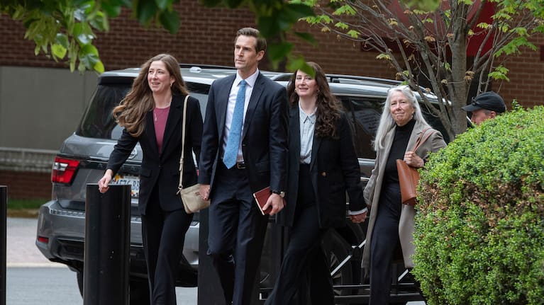 Patrice Failor, right, wife of former FBI Director James Comey, arrives, with family members, at the federal courthouse in Alexandria,.