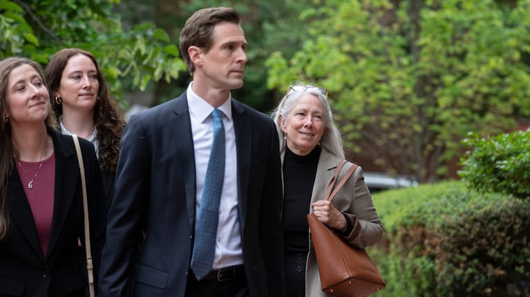Patrice Failor, right, wife of former FBI Director James Comey, arrives, with family members, at the federal courthouse in Alexandria.
