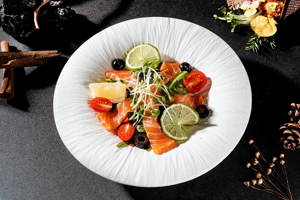 <p>Vitamin D supplements are best taken with food - ideally a meal containing healthy fats like avocado, nuts, eggs, or salmon (pictured) to help improve absorbency</p>
