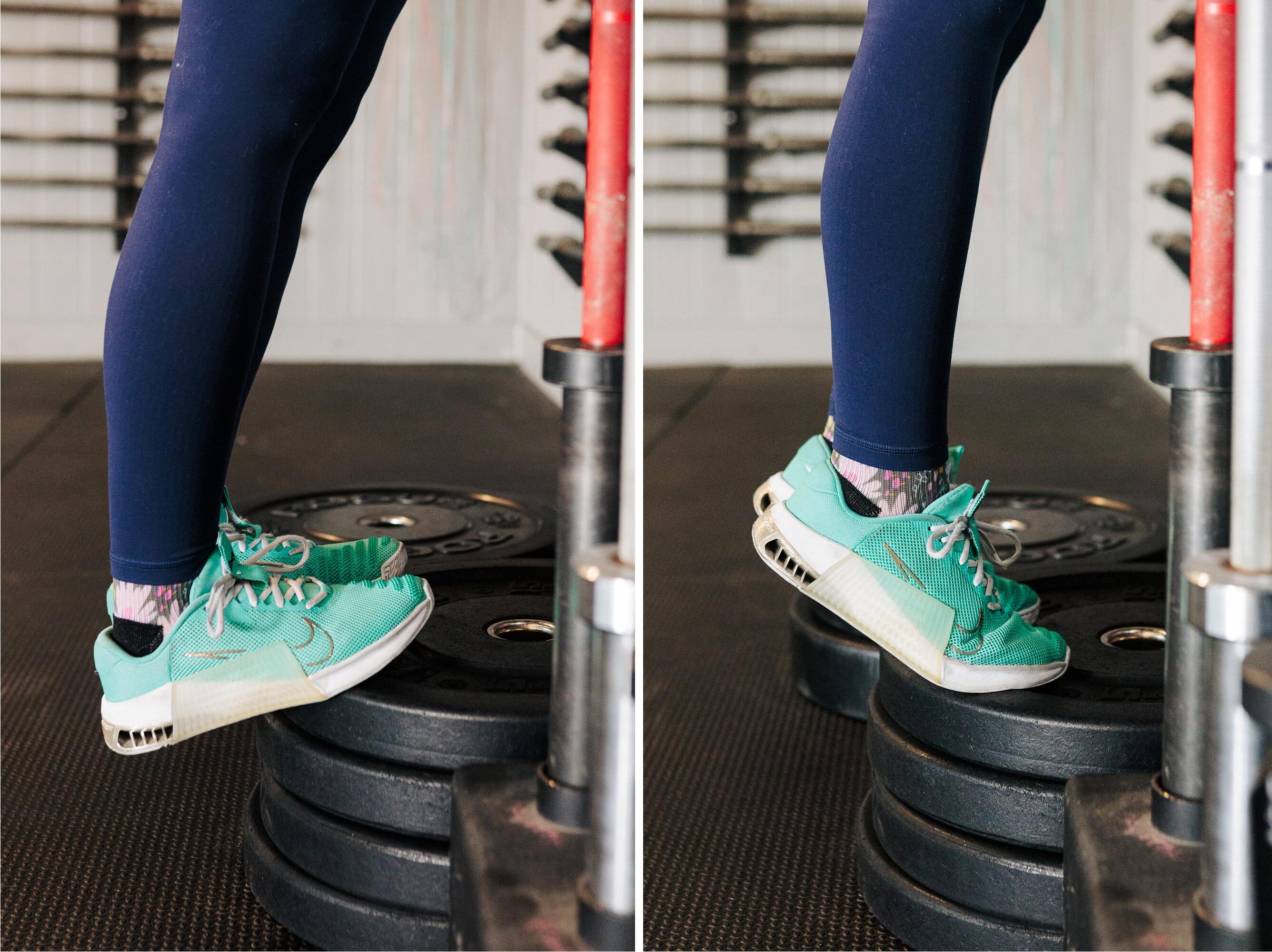 feet on pile of weights doing heel lifts